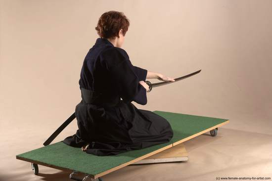 Sportswear Fighting with sword Woman White Sitting poses - ALL Slim short red Sitting poses - on knees Academic