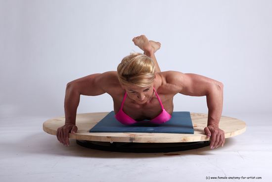 Swimsuit Gymnastic poses Woman White Kneeling poses - ALL Muscular Kneeling poses - on both knees medium blond Academic