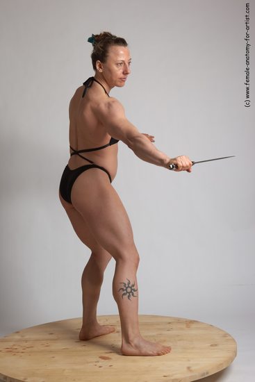 Swimsuit Fighting with knife Woman White Standing poses - ALL Muscular medium brown Standing poses - simple Academic