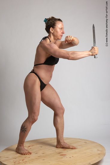 Swimsuit Fighting with knife Woman White Standing poses - ALL Muscular medium brown Standing poses - simple Academic