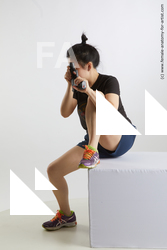 Sportswear Fighting with gun Woman Asian Sitting poses - ALL Average medium black Sitting poses - simple Standard Photoshoot Academic