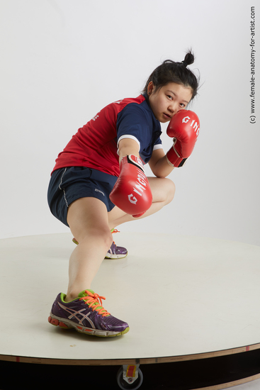 Sportswear Woman Asian Kneeling poses - ALL Average Kneeling poses - on one knee medium black Fighting Standard Photoshoot Academic