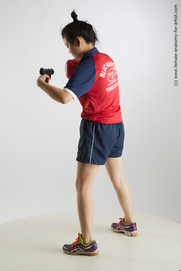 Sportswear Fighting with gun Woman Asian Standing poses - ALL Average medium black Standing poses - simple Standard Photoshoot Academic