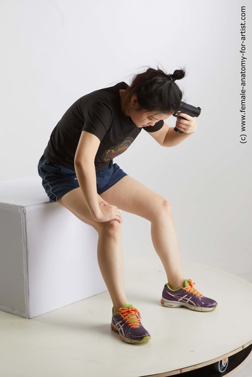 Sportswear Fighting with gun Woman Asian Sitting poses - ALL Average medium black Sitting poses - simple Standard Photoshoot Academic