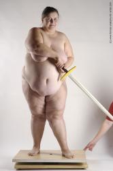 Nude Fighting with sword Woman White Standing poses - ALL Overweight medium brown Standing poses - simple Pinup