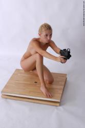 Nude Fighting with gun Woman White Kneeling poses - ALL Slim Kneeling poses - on one knee long blond Pinup