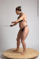 Swimsuit Fighting with knife Woman White Standing poses - ALL Muscular medium brown Standing poses - simple Academic