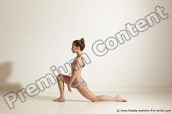 Swimsuit Gymnastic poses Woman White Moving poses Slim long brown Dynamic poses Academic