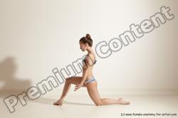 Swimsuit Gymnastic poses Woman White Moving poses Slim long brown Dynamic poses Academic