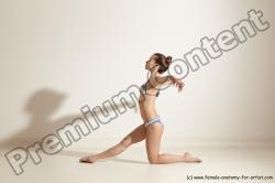 Swimsuit Gymnastic poses Woman White Moving poses Slim long brown Dynamic poses Academic