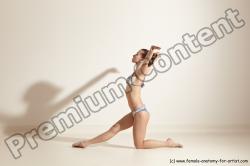 Swimsuit Gymnastic poses Woman White Moving poses Slim long brown Dynamic poses Academic