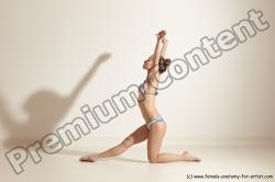 Swimsuit Gymnastic poses Woman White Moving poses Slim long brown Dynamic poses Academic