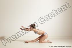 Swimsuit Gymnastic poses Woman White Moving poses Slim long brown Dynamic poses Academic