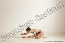 Swimsuit Gymnastic poses Woman White Moving poses Slim long brown Dynamic poses Academic