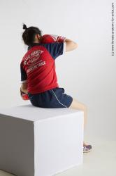 Sportswear Woman Asian Sitting poses - ALL Average medium black Sitting poses - simple Fighting Standard Photoshoot Academic