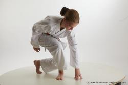 Sportswear Woman White Kneeling poses - ALL Slim Kneeling poses - on one knee long brown Standard Photoshoot  Academic